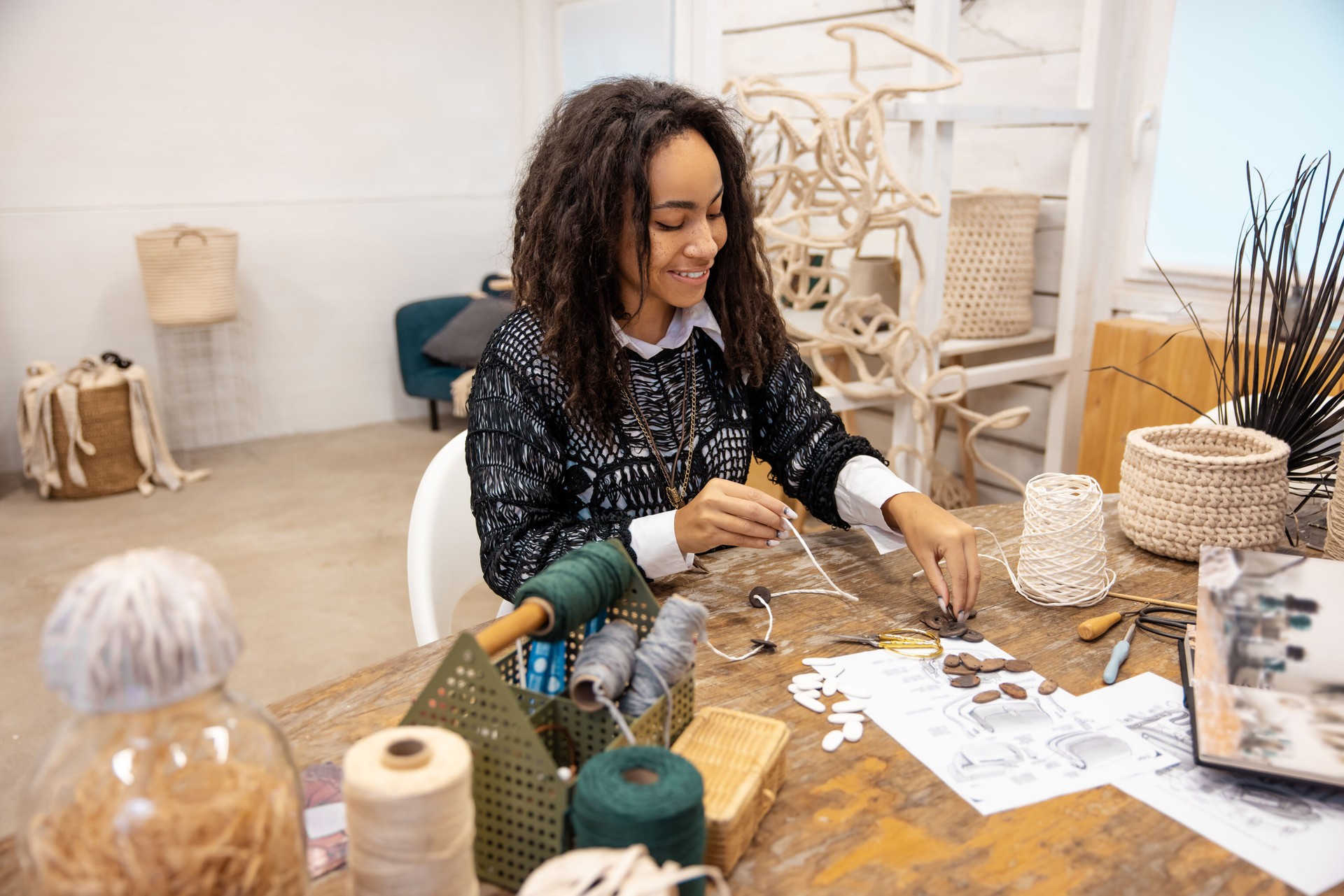 Contented artisan working on a new macrame project